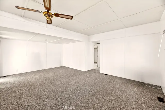 a view of a livingroom with furniture and a window