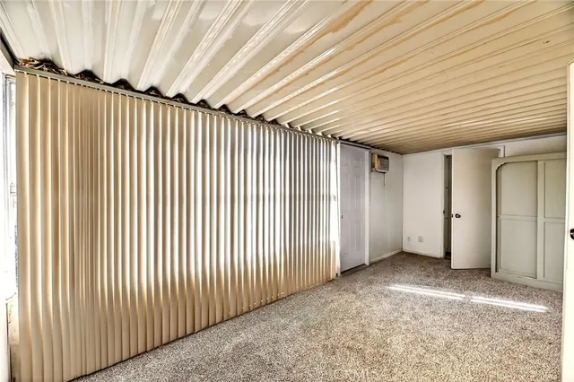 a bathroom with a sink a toilet a mirror and shower