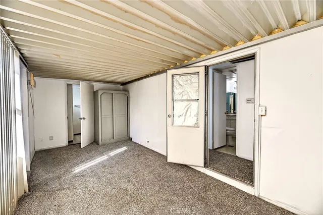 a bathroom with a granite countertop sink a mirror and a shower