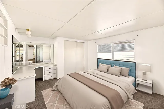 a view of a kitchen with white cabinets and sink