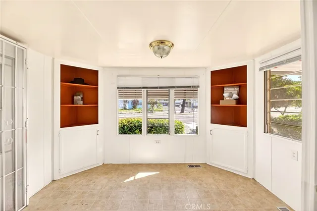 an empty room with windows