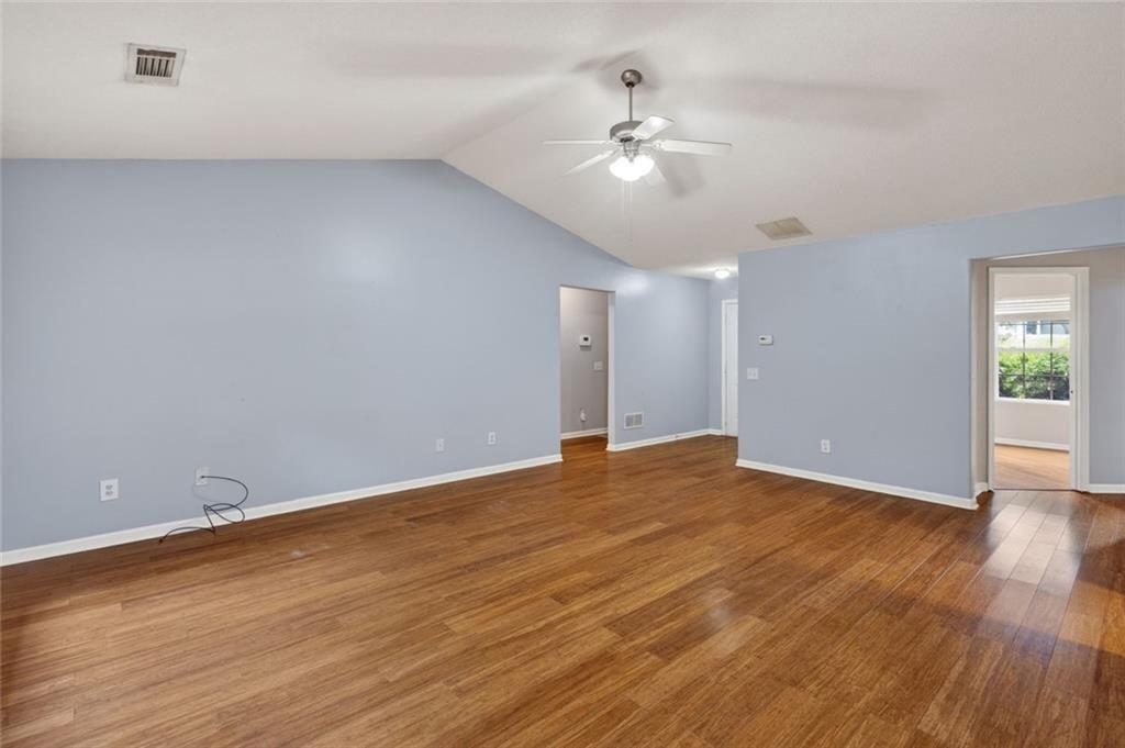 466 Raymond Drive Winder, GA 30680 - Photo 11 of 33 a view of an empty room with wooden floor