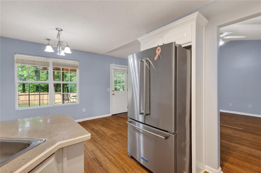 466 Raymond Drive Winder, GA 30680 - Photo 15 of 33 a kitchen with stainless steel appliances granite countertop a refrigerator and a sink