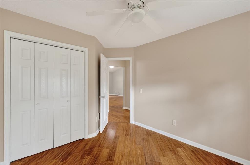 466 Raymond Drive Winder, GA 30680 - Photo 18 of 33 a view of empty room with wooden floor