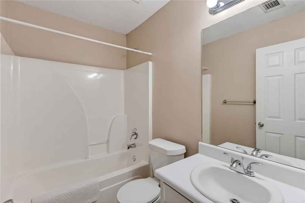 466 Raymond Drive Winder, GA 30680 - Photo 20 of 33 a bathroom with a sink toilet and shower