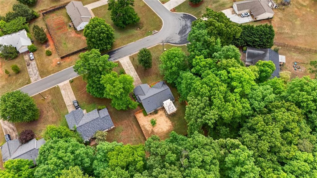 466 Raymond Drive Winder, GA 30680 - Photo 24 of 33 an aerial view of a house with a yard and garden