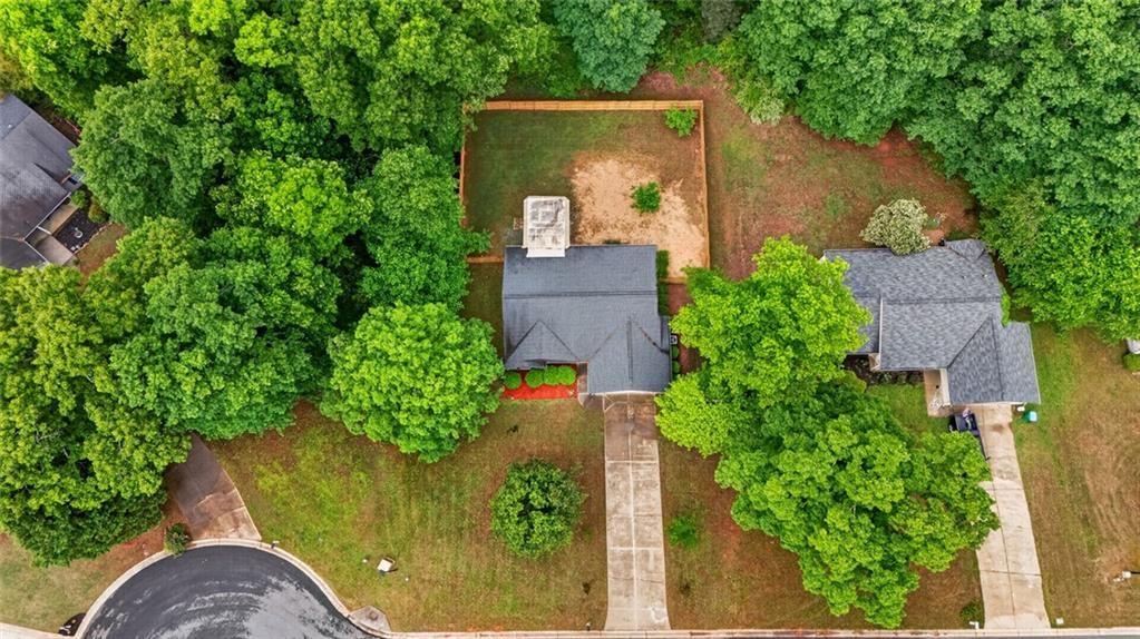 466 Raymond Drive Winder, GA 30680 - Photo 25 of 33 an aerial view of a house with garden space and a fountain