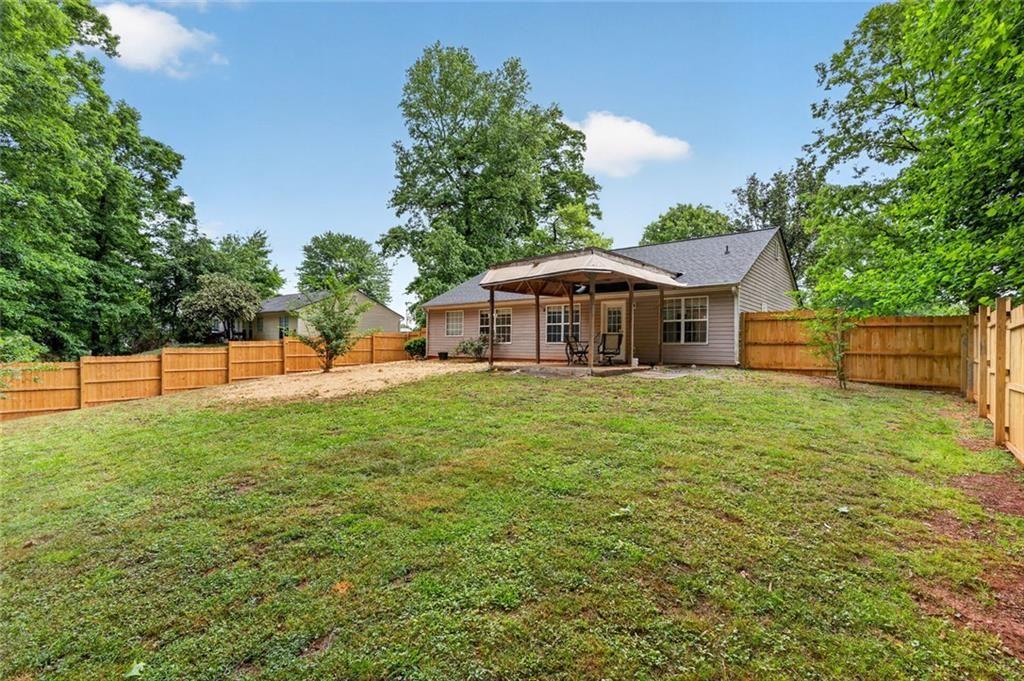 466 Raymond Drive Winder, GA 30680 - Photo 29 of 33 a view of a house with a backyard