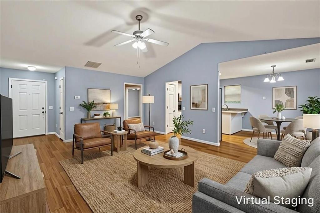 466 Raymond Drive Winder, GA 30680 - Photo 3 of 33 a living room with furniture and wooden floor