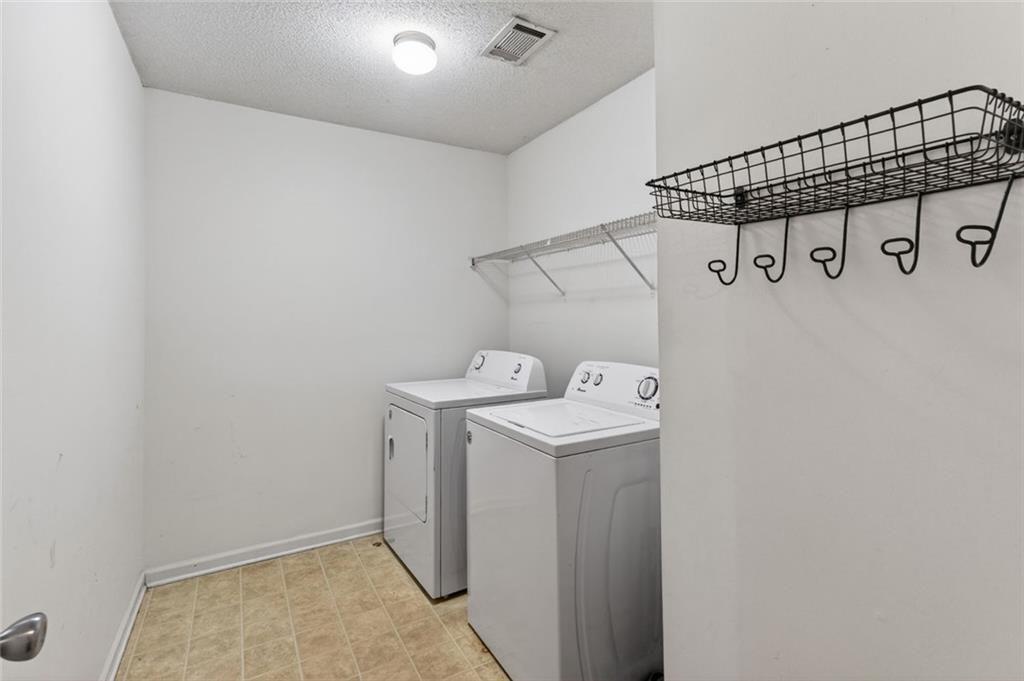 466 Raymond Drive Winder, GA 30680 - Photo 10 of 33 a utility room with dryer and washer