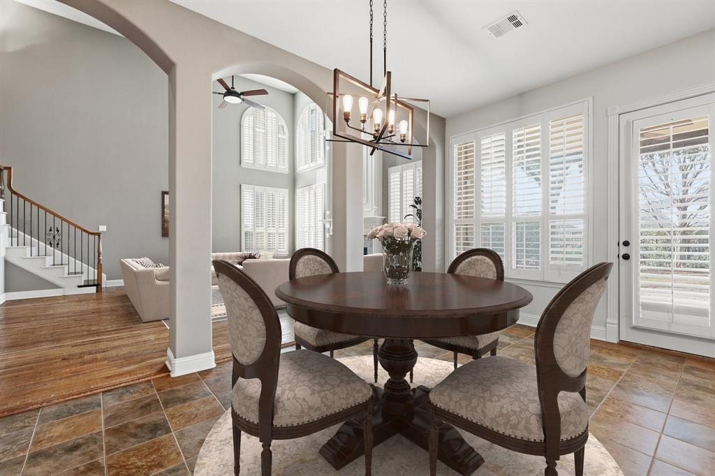 2201 Mockingbird Lane Flower Mound, TX 75022 - Photo 11 of 40 a view of a dining room with furniture window and wooden floor