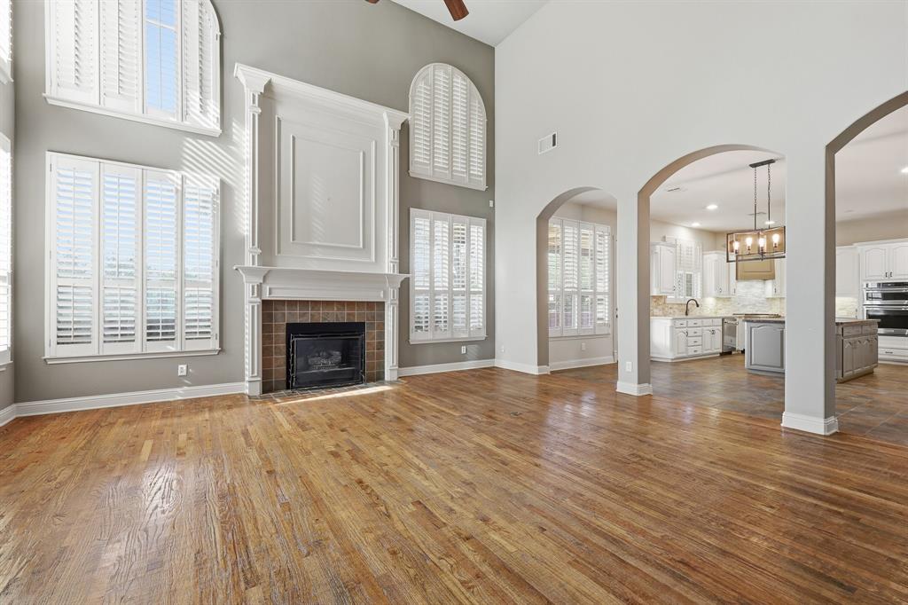 2201 Mockingbird Lane Flower Mound, TX 75022 - Photo 14 of 40 a view of an empty room with window and wooden floor