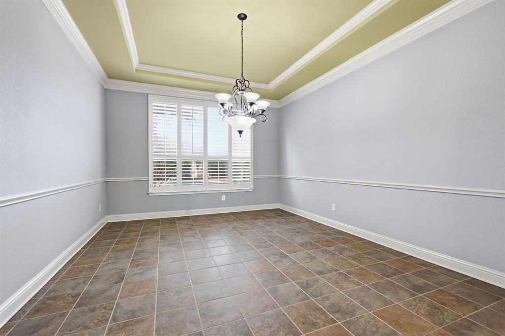 2201 Mockingbird Lane Flower Mound, TX 75022 - Photo 17 of 40 a view of a livingroom with a chandelier fan and windows