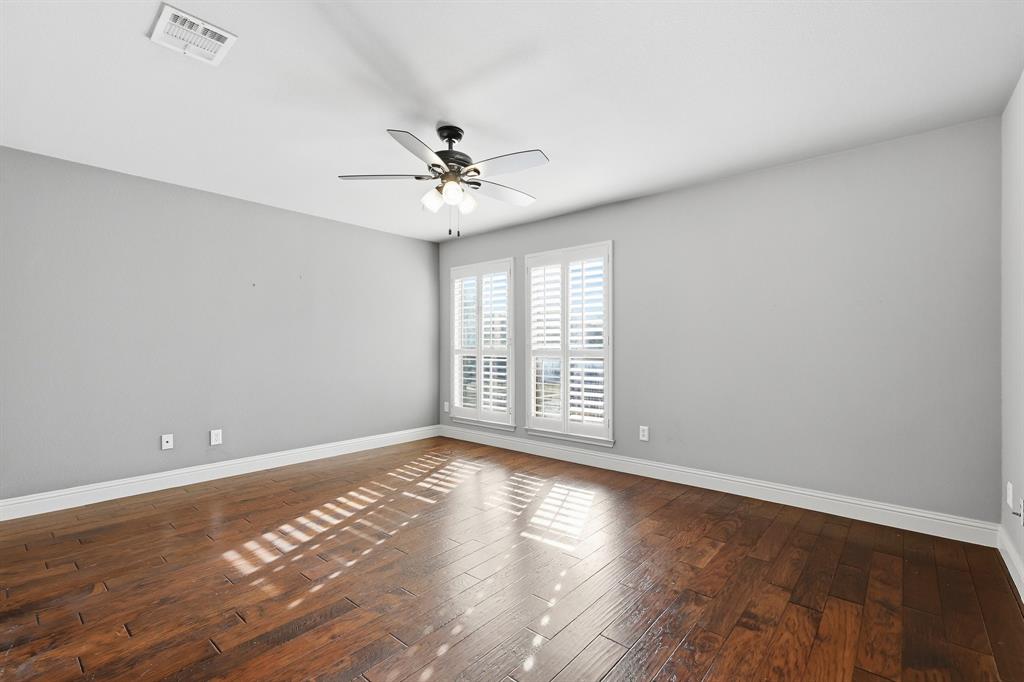 2201 Mockingbird Lane Flower Mound, TX 75022 - Photo 24 of 40 a view of an empty room with wooden floor and a window