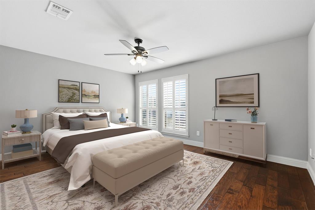 2201 Mockingbird Lane Flower Mound, TX 75022 - Photo 25 of 40 a bedroom with a bed and a chandelier