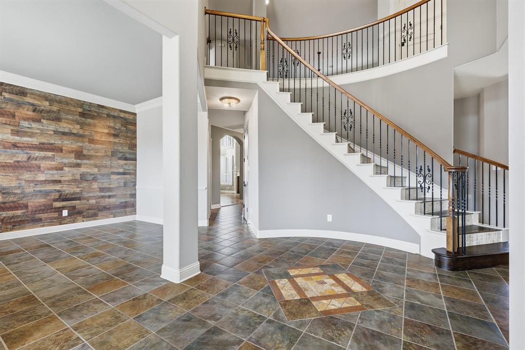 2201 Mockingbird Lane Flower Mound, TX 75022 - Photo 4 of 40 a view of entryway and hall with wooden floor