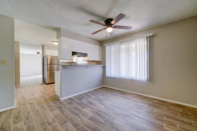 a view of a kitchen with a sink cabinet and a window