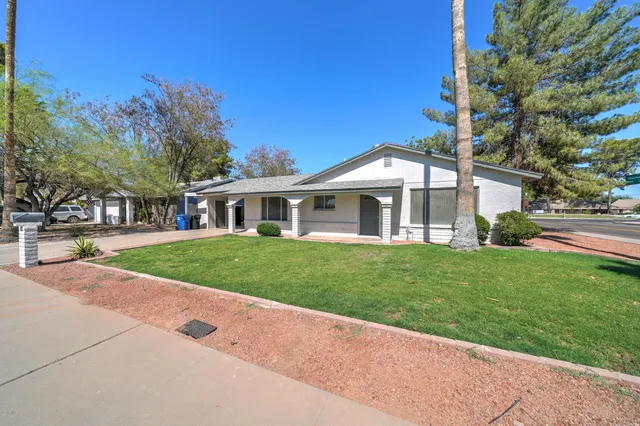 front view of a house with a yard