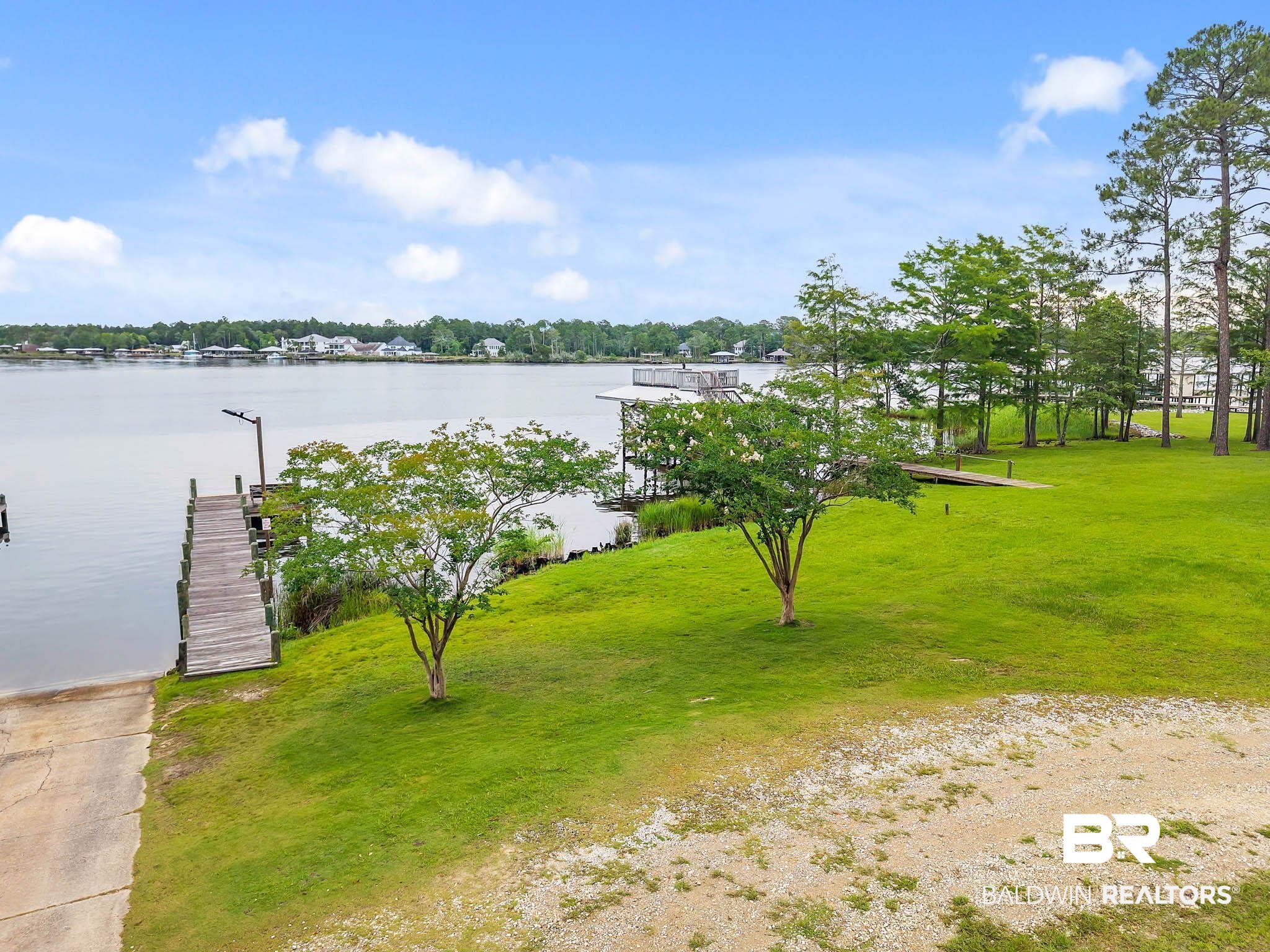 8145 Bay View Drive Foley, AL 36535 - Photo 75 of 81 Dock with a water view and a lawn