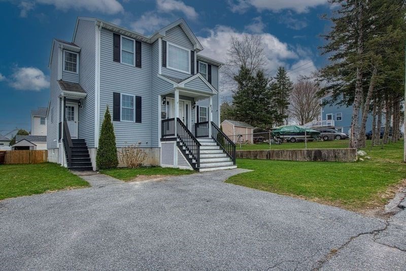 438 Smith Street Fall River, MA 02721 - Photo 1 of 31 a front view of house with yard and green space