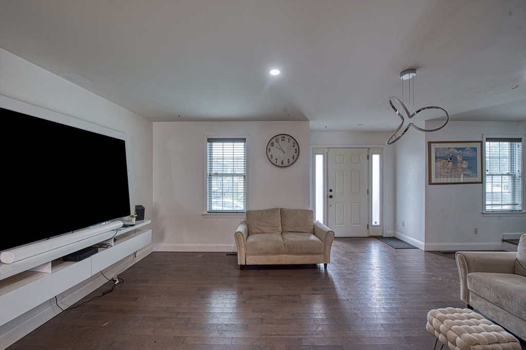 438 Smith Street Fall River, MA 02721 - Photo 12 of 31 a living room with furniture and a flat screen tv