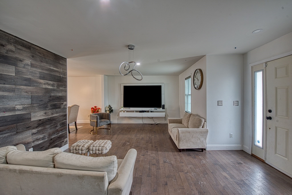 438 Smith Street Fall River, MA 02721 - Photo 13 of 31 a living room with furniture and a flat screen tv