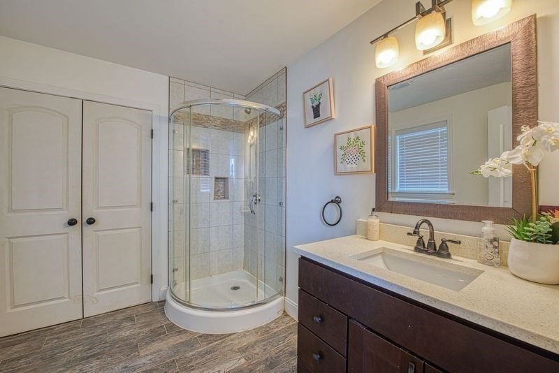 438 Smith Street Fall River, MA 02721 - Photo 14 of 31 a bathroom with a sink a toilet and shower