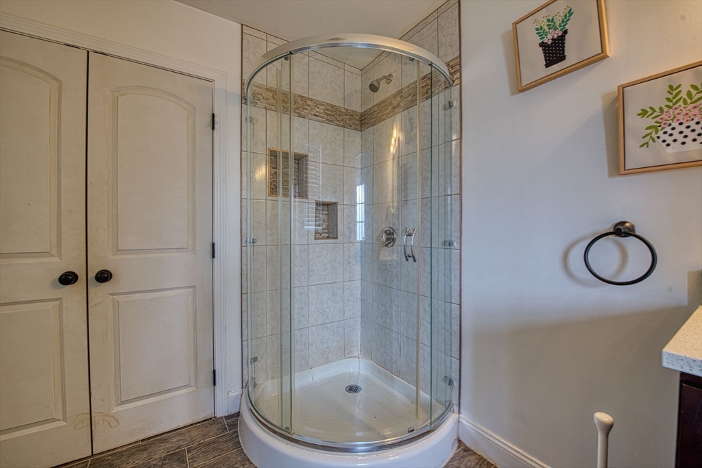 438 Smith Street Fall River, MA 02721 - Photo 15 of 31 a bathroom with a shower a toilet and sink