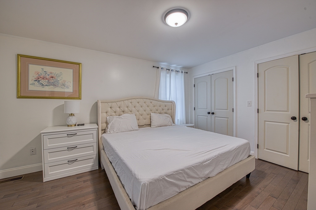 438 Smith Street Fall River, MA 02721 - Photo 18 of 31 a bedroom with a bed and a closet