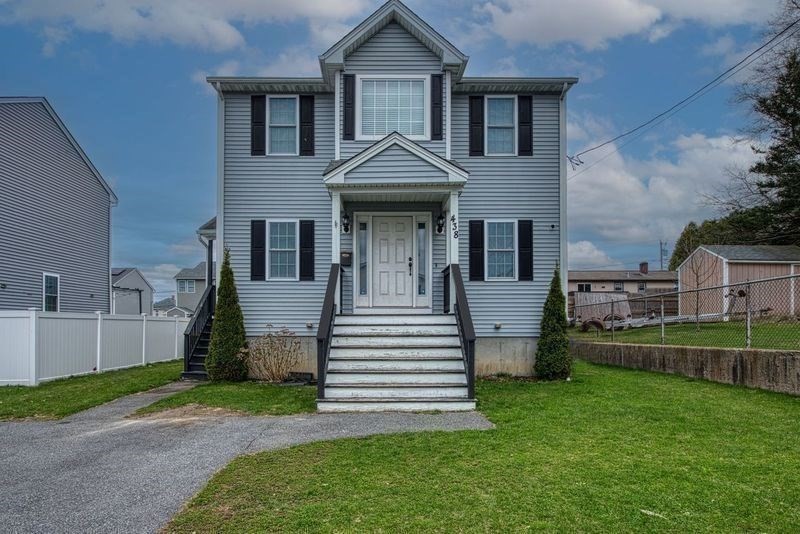 438 Smith Street Fall River, MA 02721 - Photo 2 of 31 a front view of a house with a yard