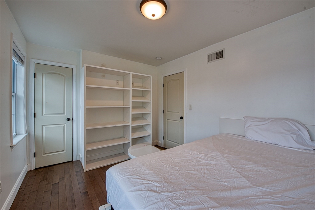 438 Smith Street Fall River, MA 02721 - Photo 27 of 31 a bedroom with a bed and a closet