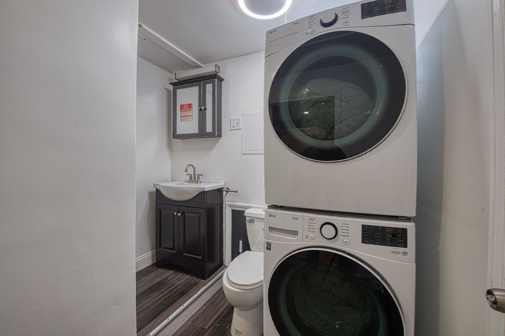 438 Smith Street Fall River, MA 02721 - Photo 28 of 31 a view of a hallway with washer and dryer