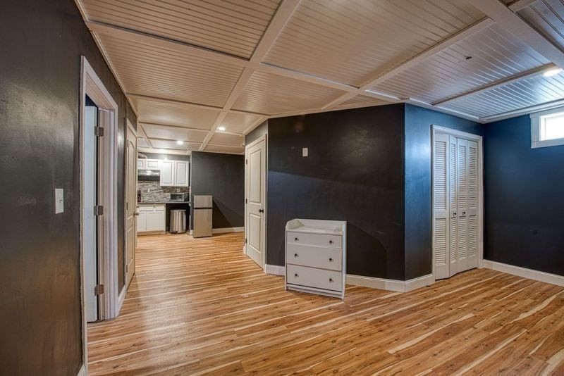 438 Smith Street Fall River, MA 02721 - Photo 29 of 31 a view of a hallway with wooden floor