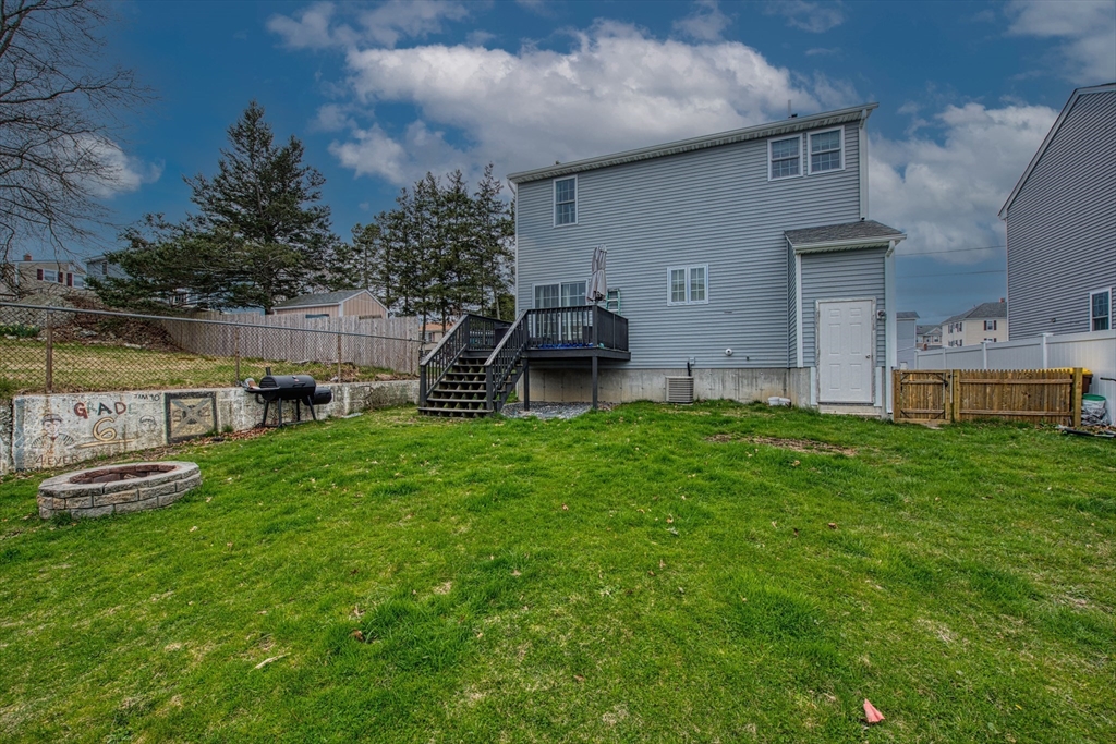 438 Smith Street Fall River, MA 02721 - Photo 3 of 31 a view of a house with a backyard and a garden