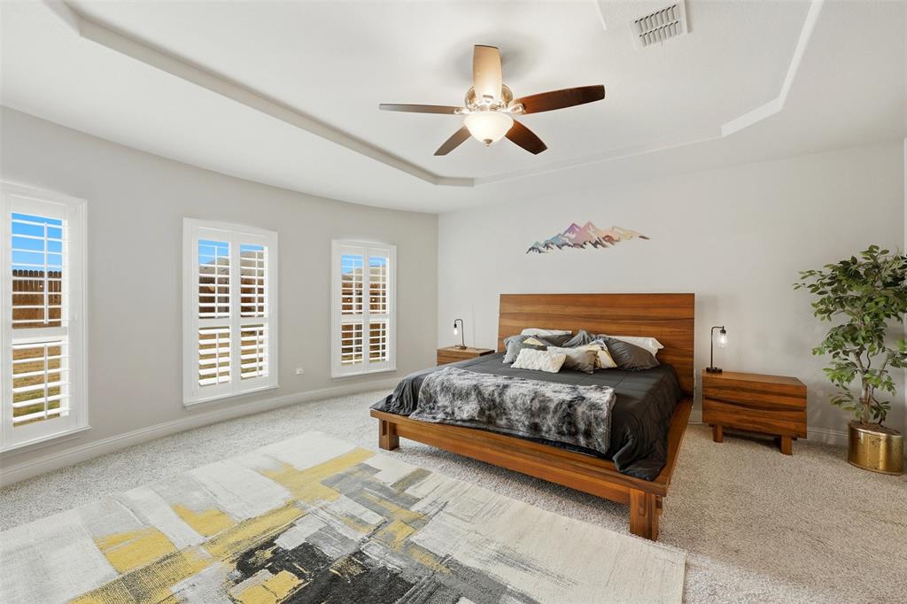 a bedroom with a large bed and a window