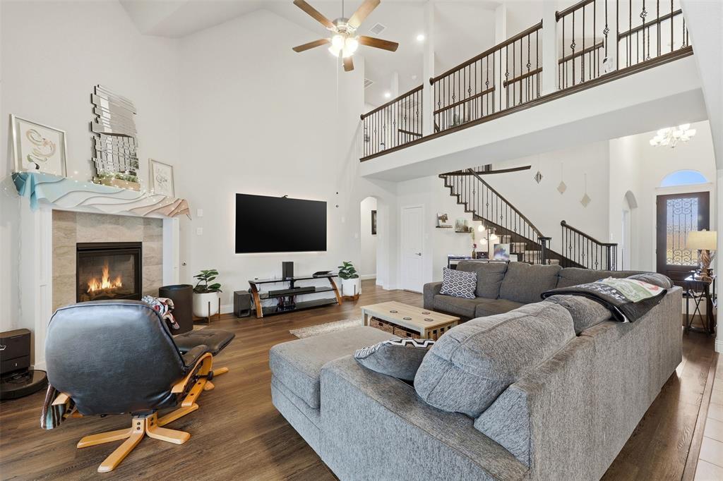 418 Crestview Drive Midlothian, TX 76065 - Photo 11 of 39 a living room with furniture flat screen tv and a fireplace
