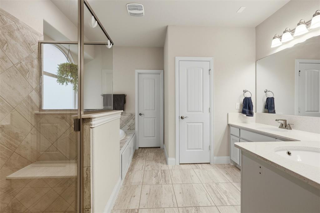 418 Crestview Drive Midlothian, TX 76065 - Photo 16 of 39 a bathroom with a sink a mirror and a shower