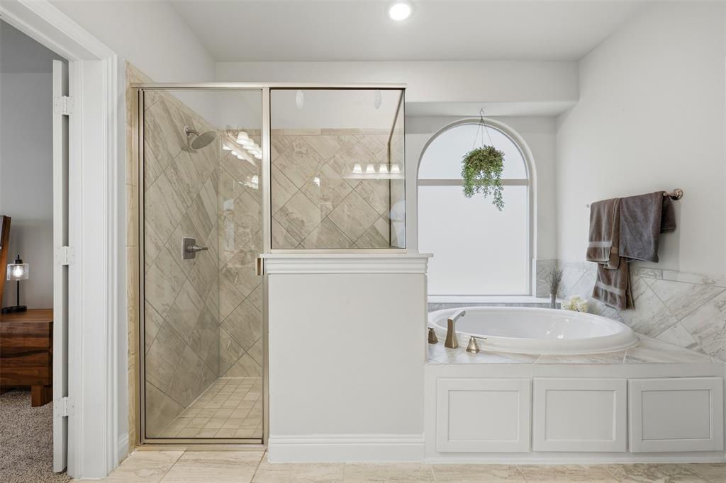418 Crestview Drive Midlothian, TX 76065 - Photo 17 of 39 a bathroom with a granite countertop sink a mirror and shower