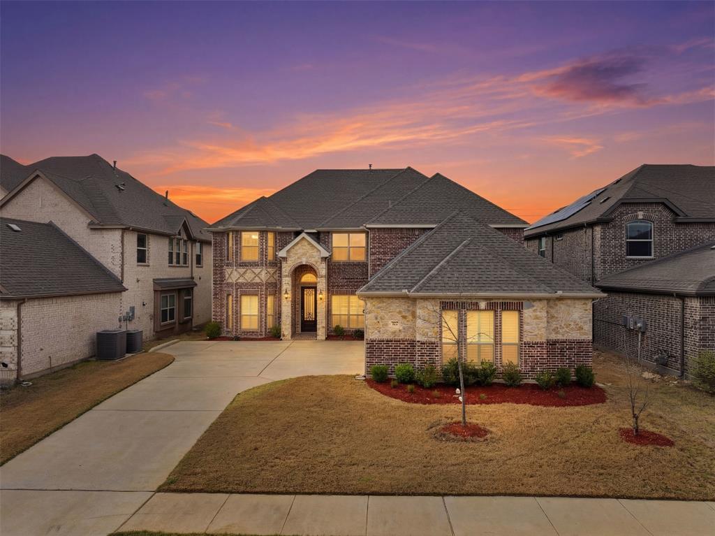 418 Crestview Drive Midlothian, TX 76065 - Photo 2 of 39 a front view of a house with garage and parking