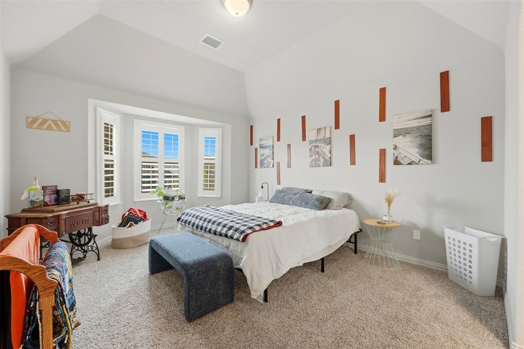 418 Crestview Drive Midlothian, TX 76065 - Photo 20 of 39 a bedroom with a bed furniture and a flat tv screen