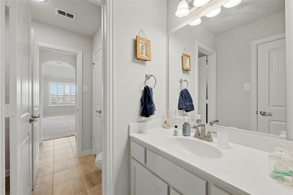 418 Crestview Drive Midlothian, TX 76065 - Photo 21 of 39 a bathroom with a sink vanity and mirror