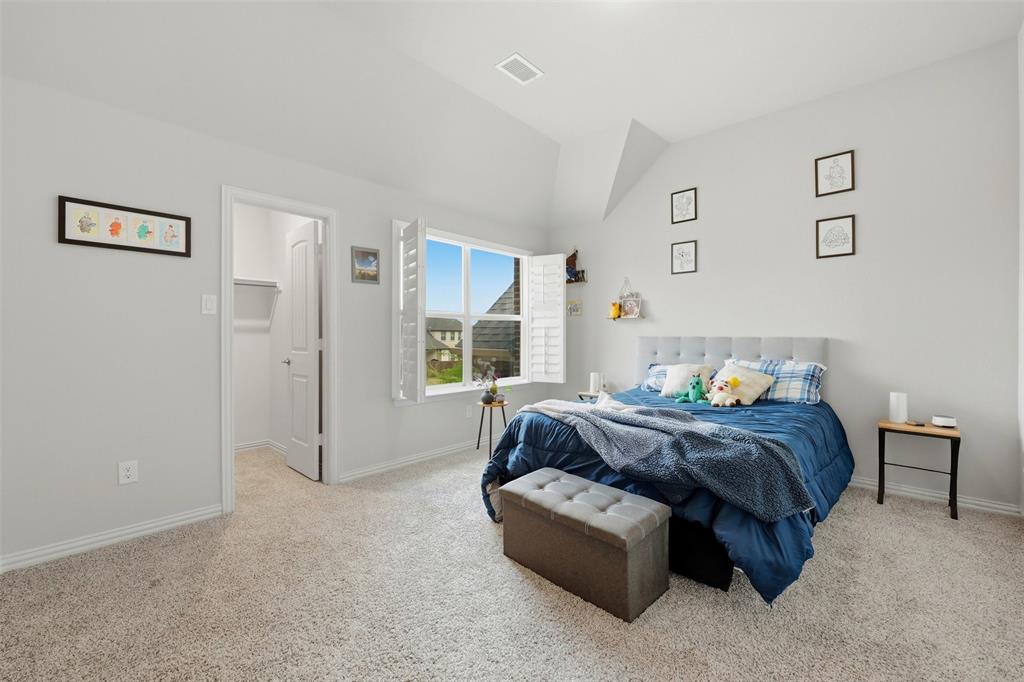 418 Crestview Drive Midlothian, TX 76065 - Photo 28 of 39 a bed room with a bed and a couch