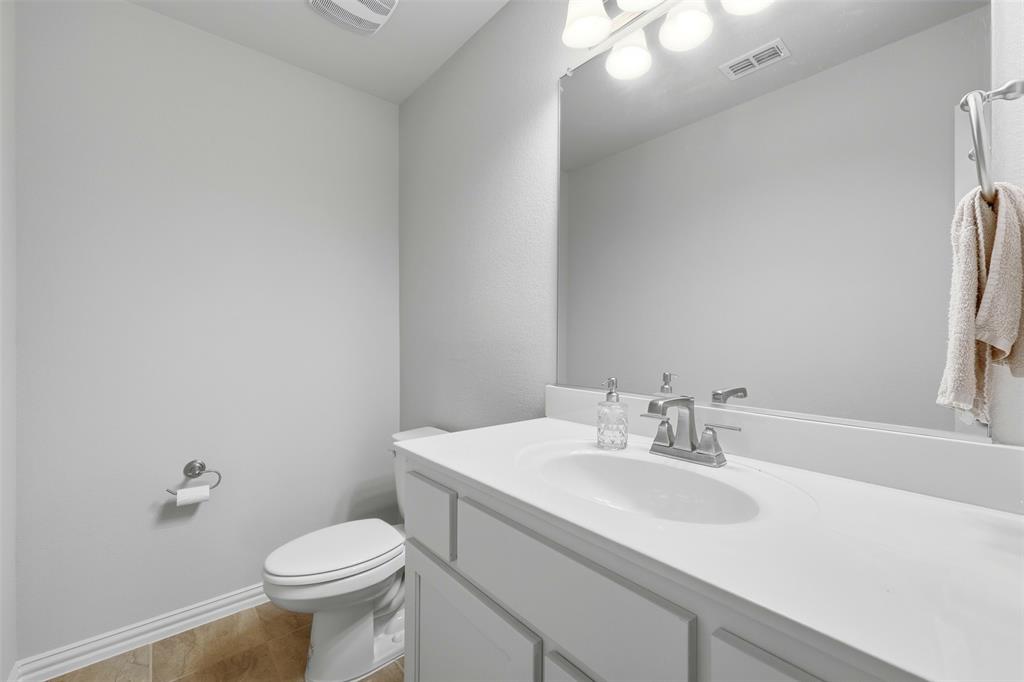 418 Crestview Drive Midlothian, TX 76065 - Photo 29 of 39 a bathroom with a sink toilet and a mirror