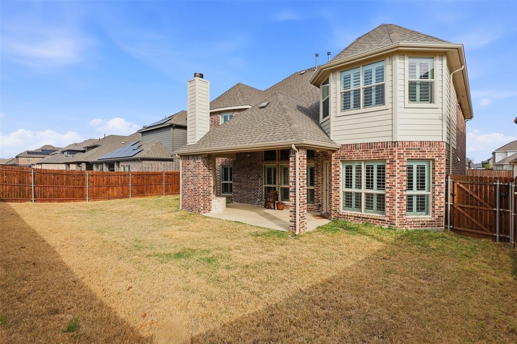 418 Crestview Drive Midlothian, TX 76065 - Photo 34 of 39 a front view of a house with a yard outdoor seating and garage