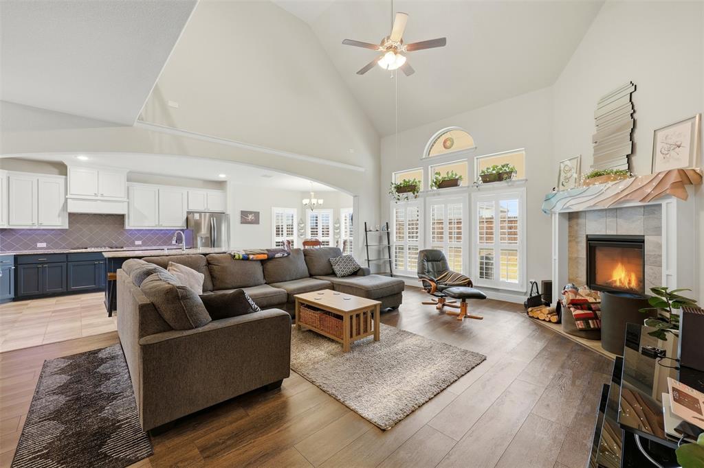418 Crestview Drive Midlothian, TX 76065 - Photo 9 of 39 a living room with fireplace furniture and a wooden floor