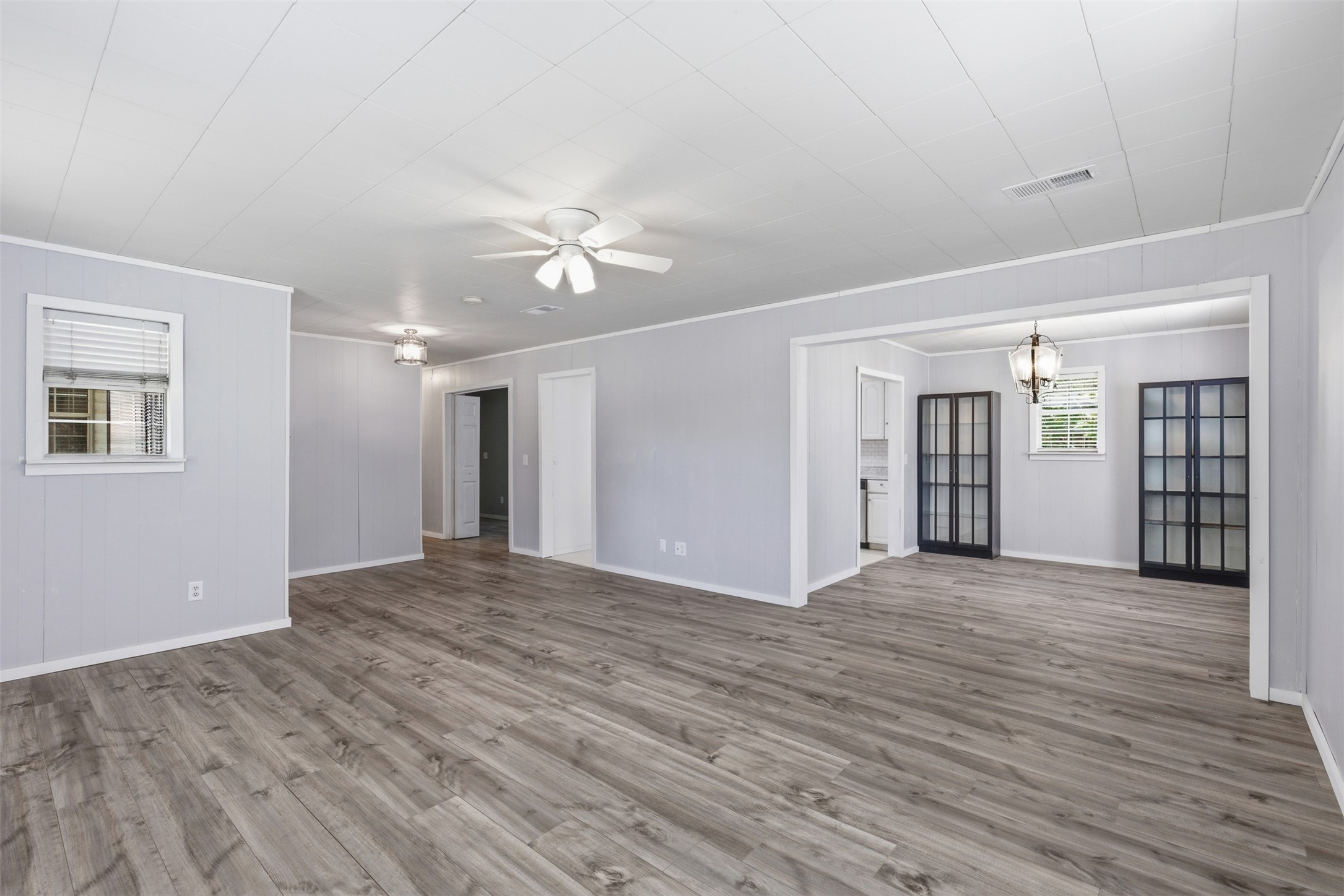 1310 Brazos Street Hempstead, TX 77445 - Photo 6 of 32 a view of an empty room with window and wooden floor