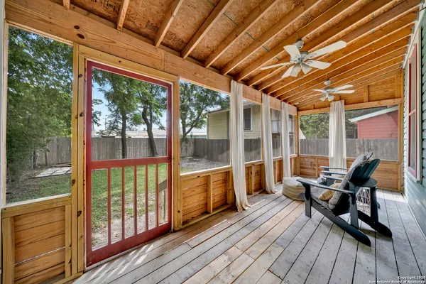 a balcony with wooden floor