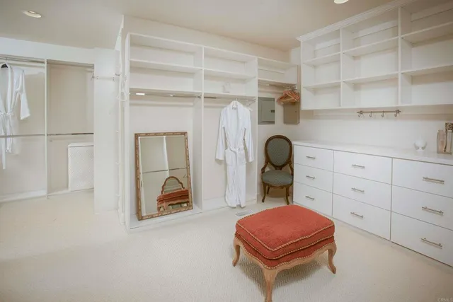 a living room with furniture a fireplace and gym equipment