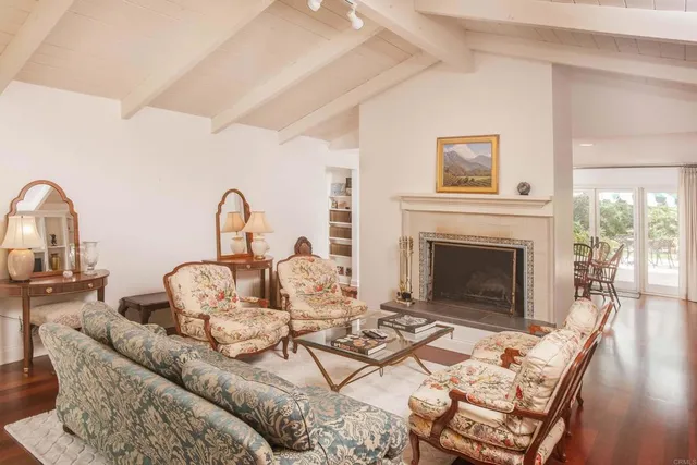 a dining room with furniture and wooden floor