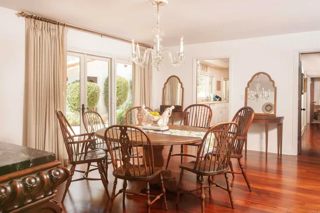 a large kitchen with stainless steel appliances a lot of counter space and wooden floor